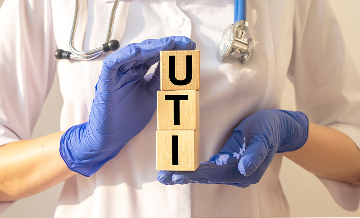 How does a woman get a urinary tract infection?